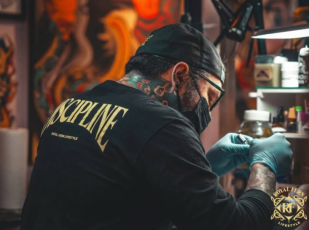 Royal Fern Lifestyle discipline shirt in a tattoo studio.
